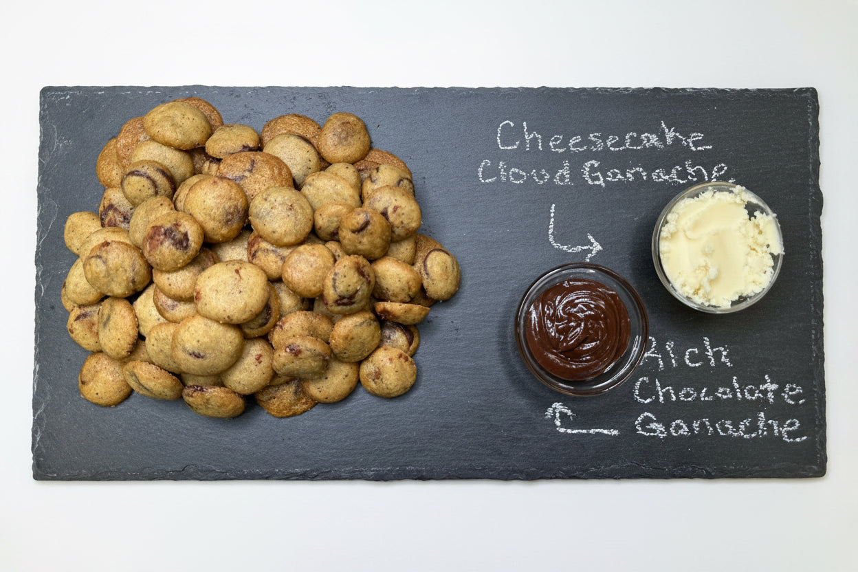 Cookies with vanilla cheesecake cream and rich chocolate cream on a slate board.