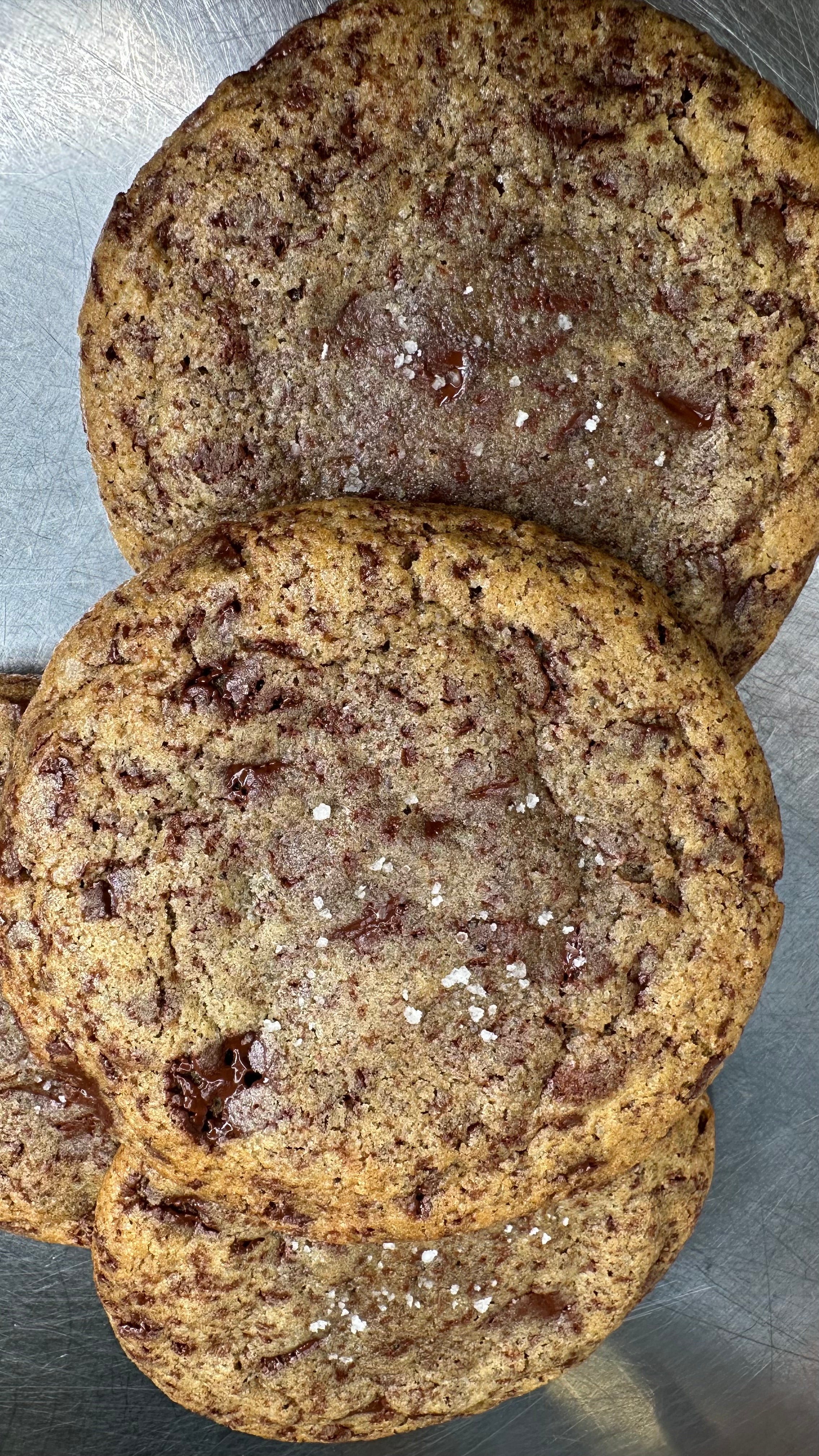 Close-up of chocolate chip cookies on a metal surface